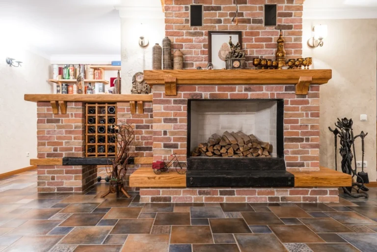 Brick fireplace with firewood stacked in the firebox