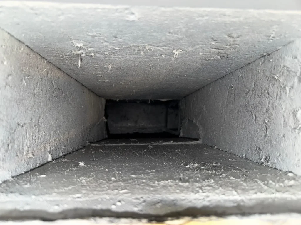 Clean sheet metal supply trunk after professional duct cleaning
