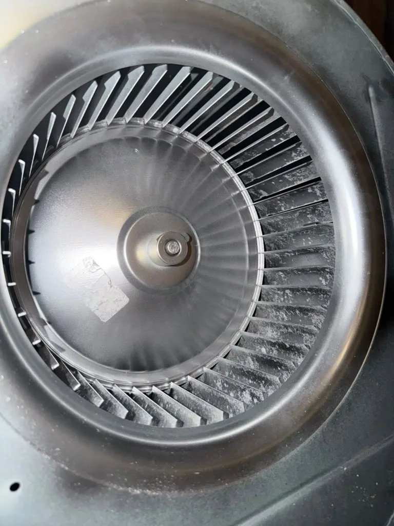 Close-up of a cleaned blower wheel and motor shaft