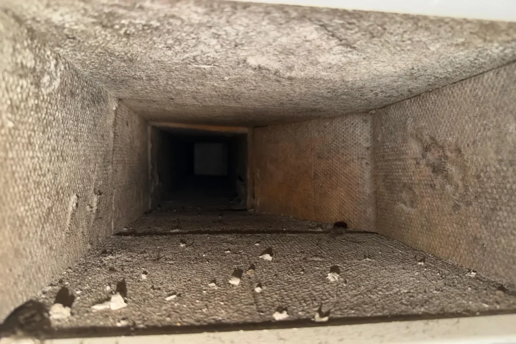 Construction dust in a duct – Post-Construction Air Duct Cleaning