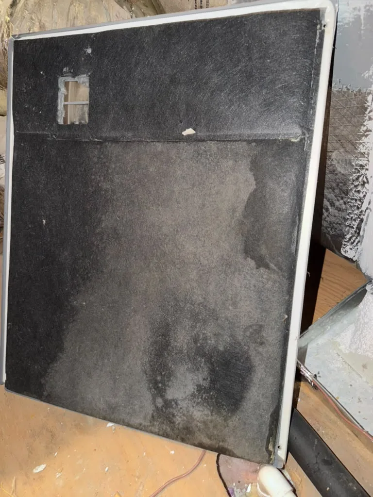 Dirty return air filter pulled out during an air filter check