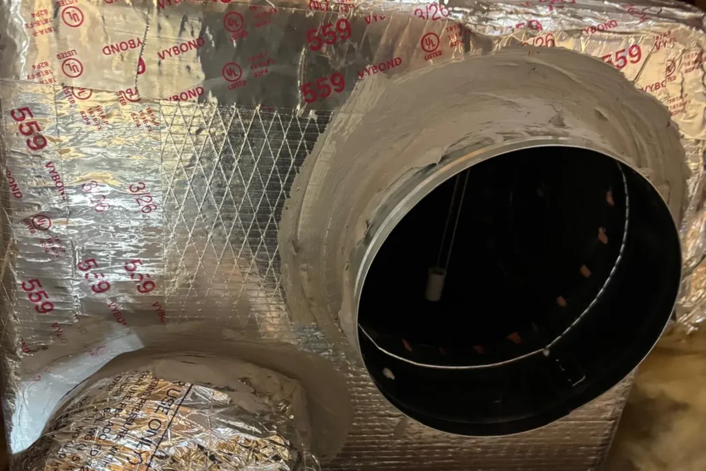 Duct collar on an attic supply plenum