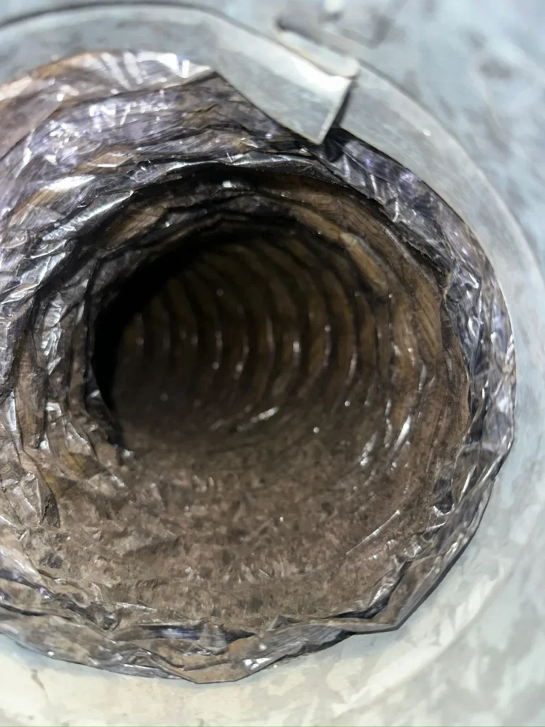 Dust lining the inside of a flexible duct