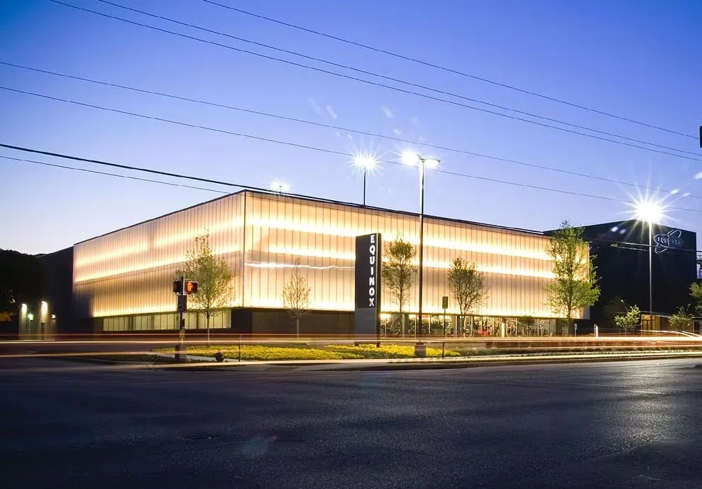 Equinox fitness club building at dusk