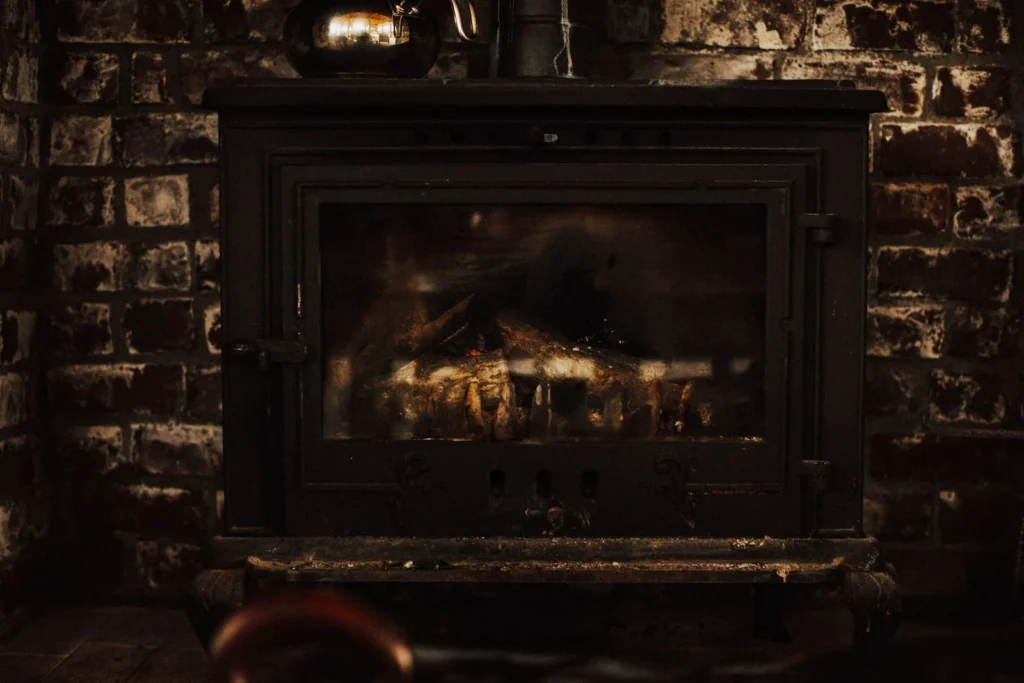 Fireplace insert set into a brick chimney wall