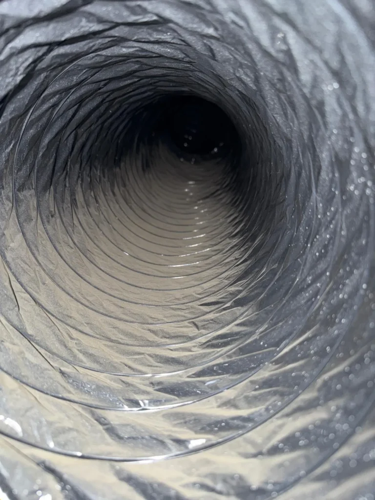 Flexible air duct run inside a home
