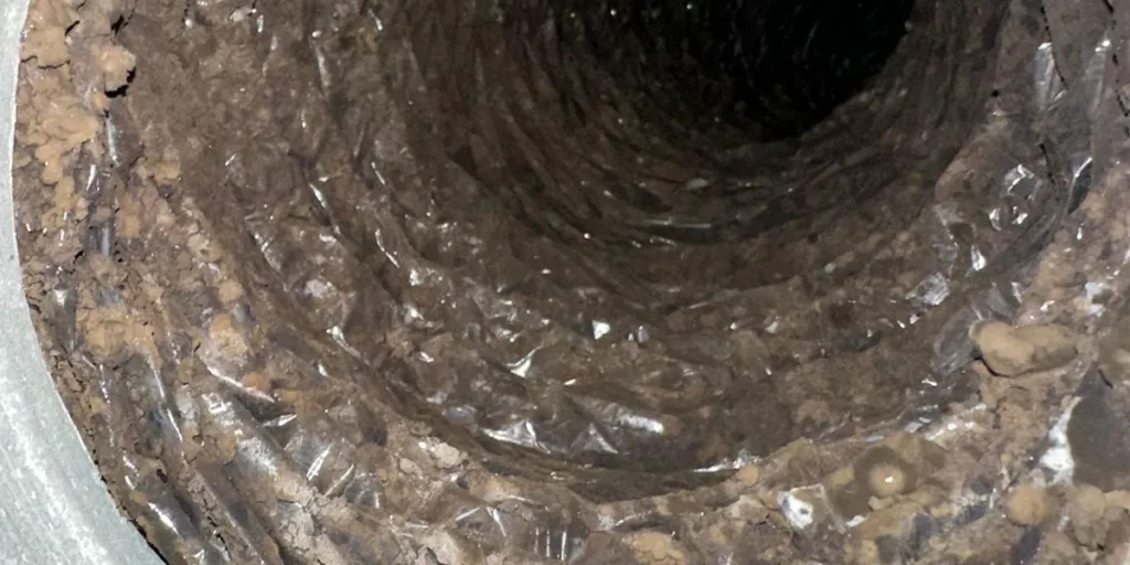 Heavy dust and debris inside a flexible air duct