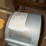 HVAC blower assembly removed for cleaning