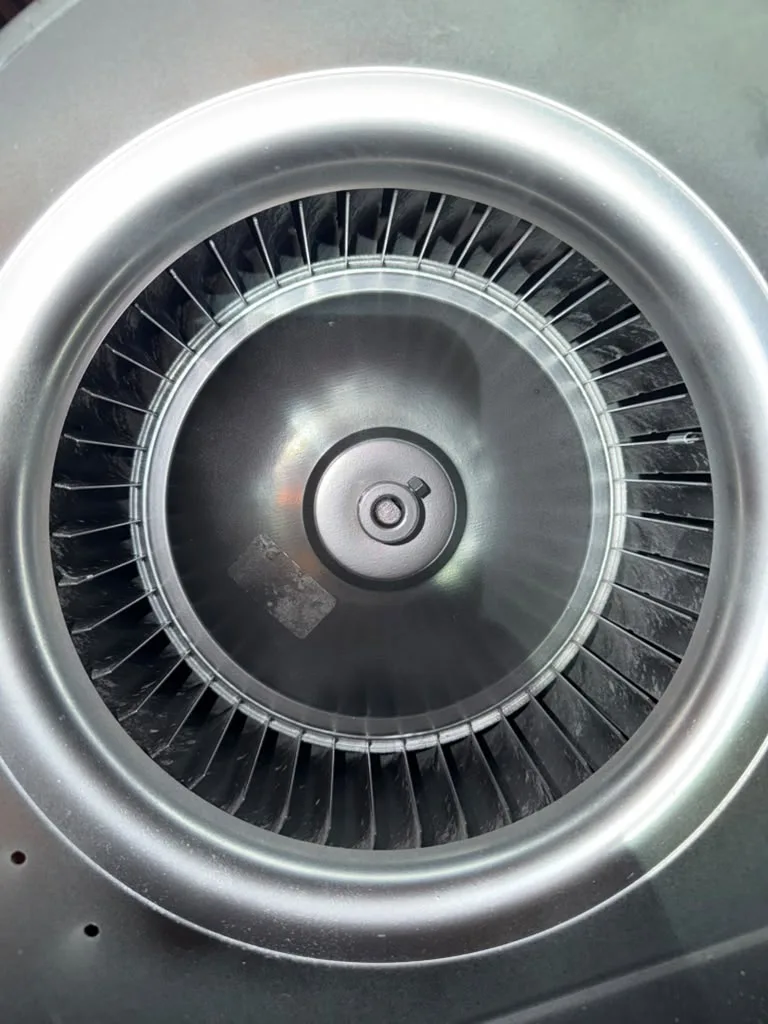 HVAC blower wheel with clean blades after cleaning
