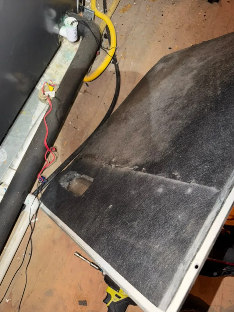 HVAC cabinet panel opened during service