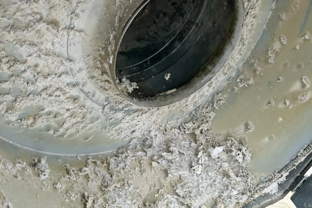 Lint in a commercial exhaust fan – Commercial & Multi-Family Dryer Vent Cleaning