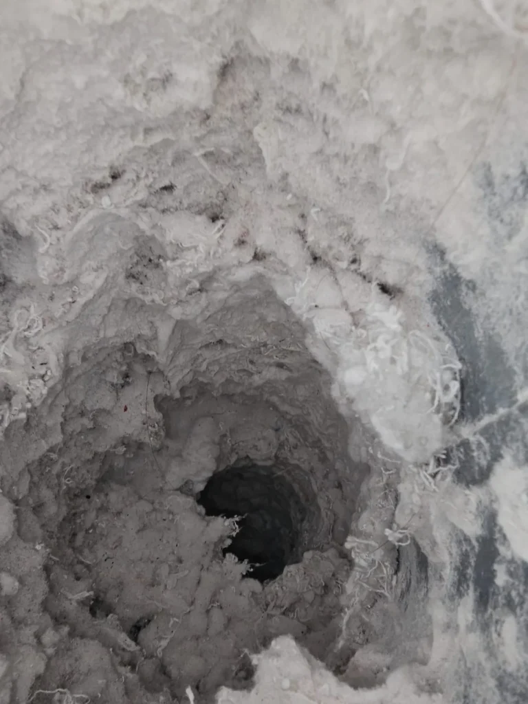 Lint packed inside a residential dryer vent duct
