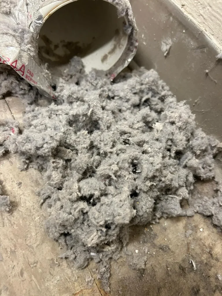 Lint pulled out of a residential dryer vent