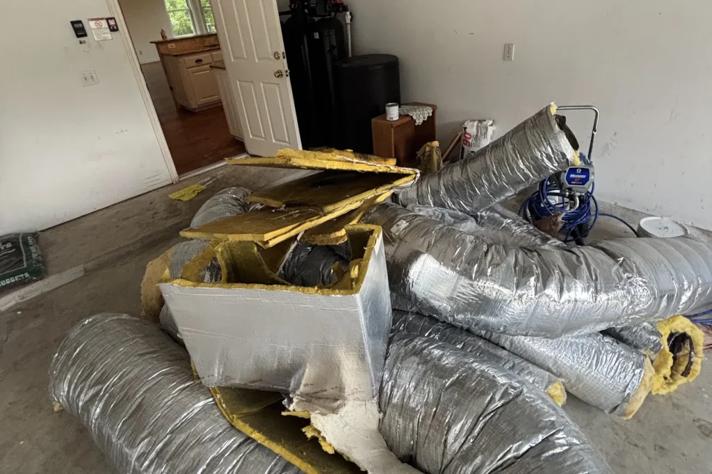 Old flexible ductwork and plenum removed during a duct replacement
