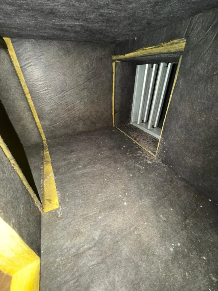 Supply plenum with a return grille in view (Lockhart area)