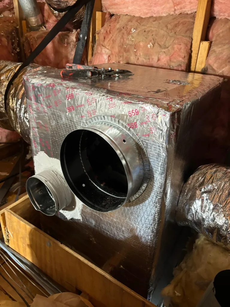 Supply plenum with new duct connections in an attic
