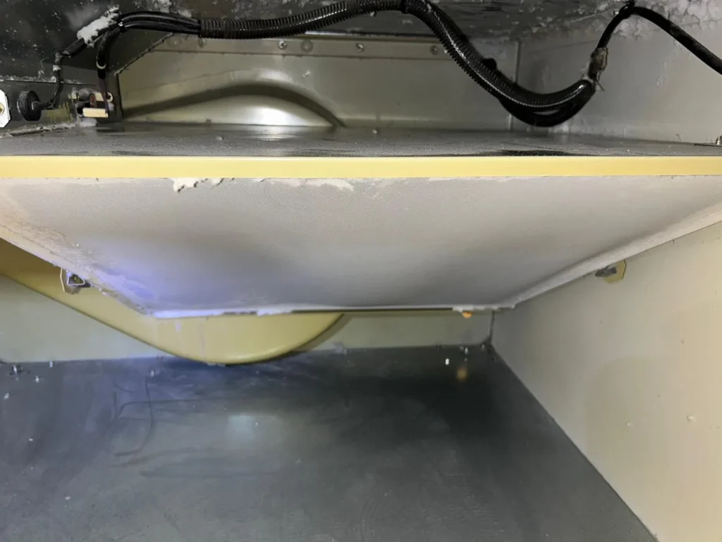 The same commercial dryer lint chamber clean after lint removal