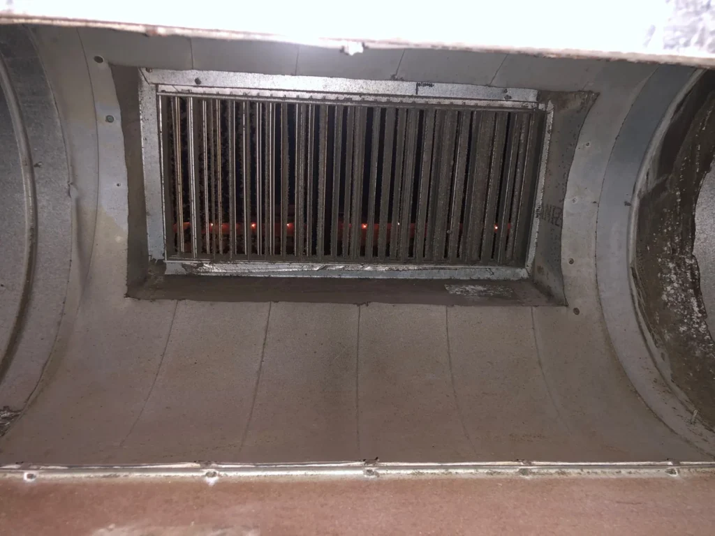 The same commercial supply plenum clean after duct cleaning
